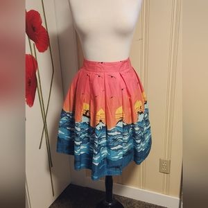 Pleated surfer girl print skirt